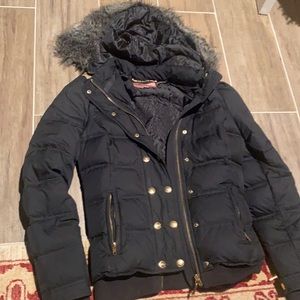 Black puffer jacket. Great for skiing and colder climate